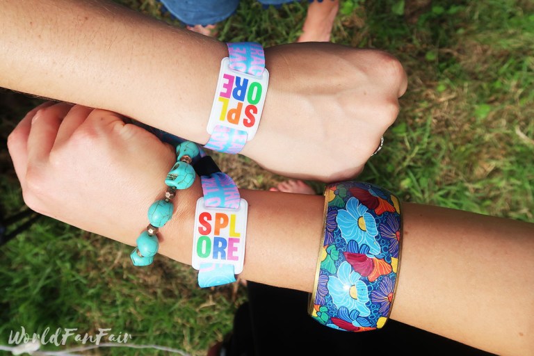 Rainbow Splore wristbands on wrists