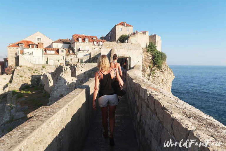 Women walking along the top of the walls