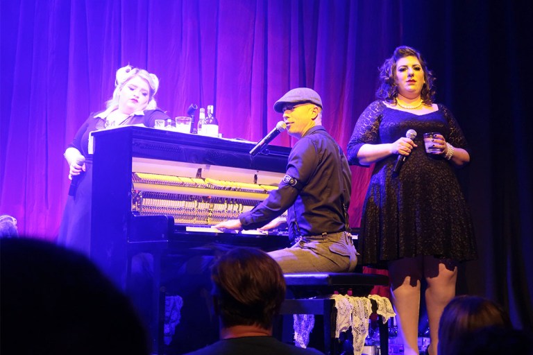 Two female comedians and a piano-man